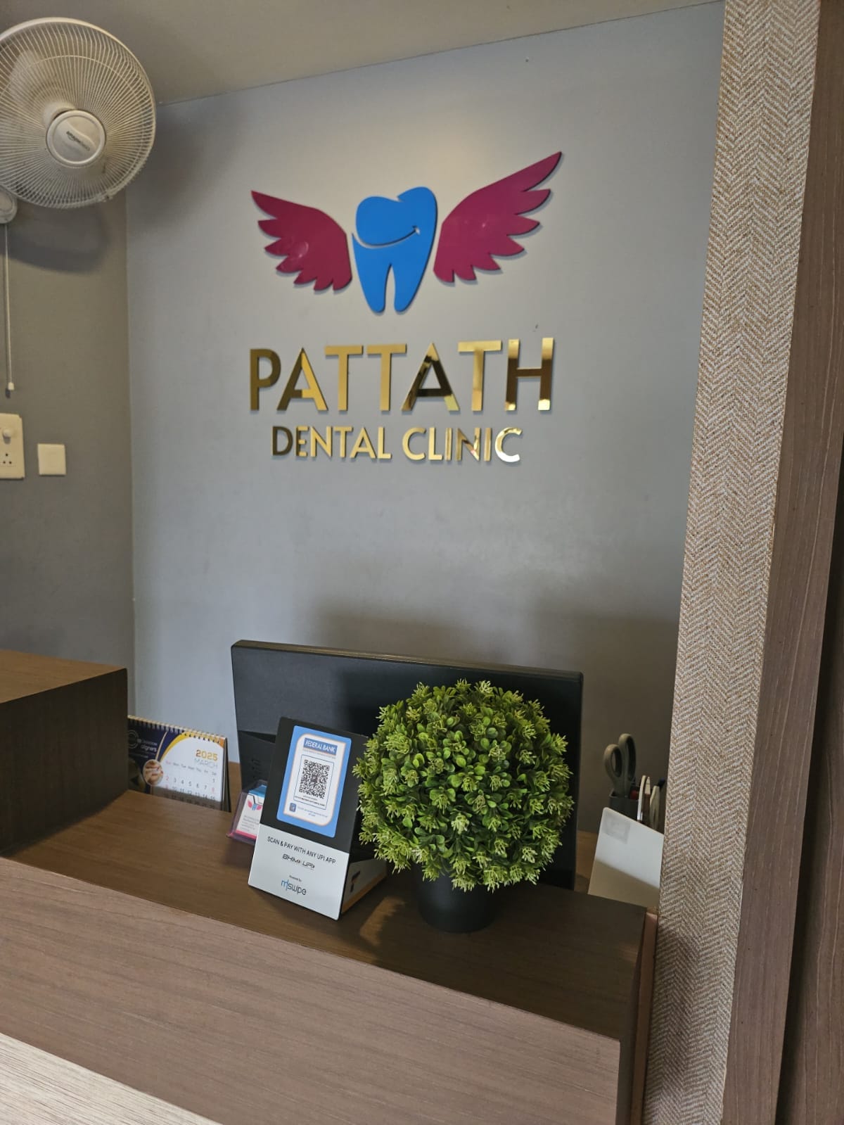 Pattath Dental Clinic reception desk and signage
